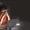Woman at a desk with a laptop head in hands looking stressed The Portfolio Magazine logo in the top left corner