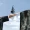 Revealing Structural Gaps in CSuite Succession Planning The Portfolio Businessman in a suit walks across an outstretched hand spanning a chasm briefcase in hand under a blue sky with The Portfolio Magazine logo in the corner
