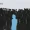 The Hidden Cost of Being a Nice Leader The Portfolio A crowd of dark silhouettes with one light blue figure standing out in the center left symbolizing individuality logo in top left reads The Portfolio Magazine