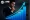 Businessman in a suit examining a blue rising bar chart with an upward arrow