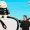 Meta and Firms Team Up to Tame AI Bot Business Chaos The Portfolio Man in a black shirt stands beside oversized sunglasses with a plush figure perched on top on a stage at a talk